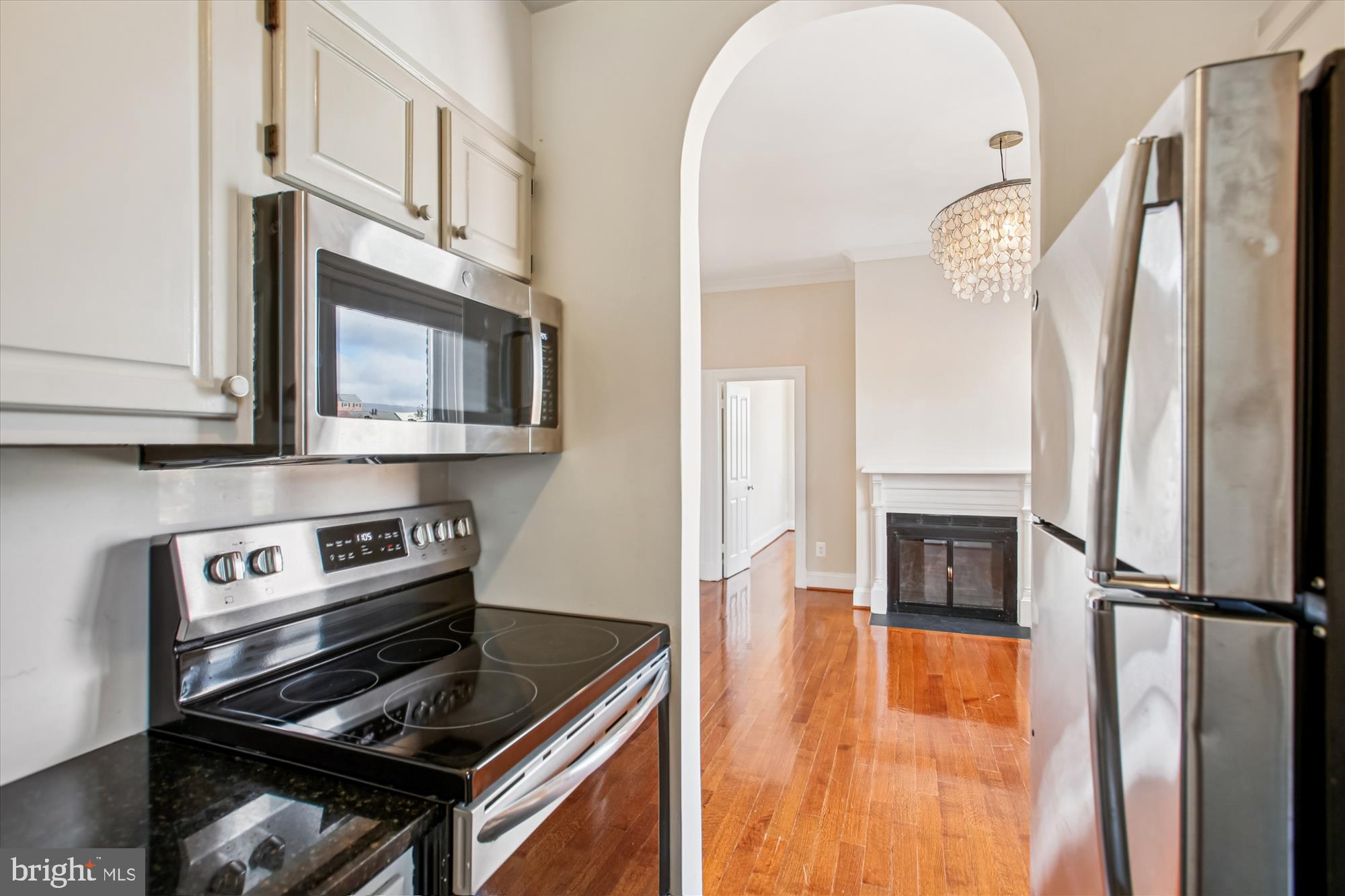 2008 16th Street Northwest, Unit 402 Washington, DC 20009 - Photo 23 of 34 a kitchen with stainless steel appliances granite countertop a refrigerator stove top oven and sink