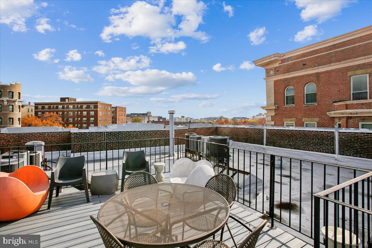 2008 16th Street Northwest, Unit 402 Washington, DC 20009 - Photo 27 of 34 a balcony with table and chairs