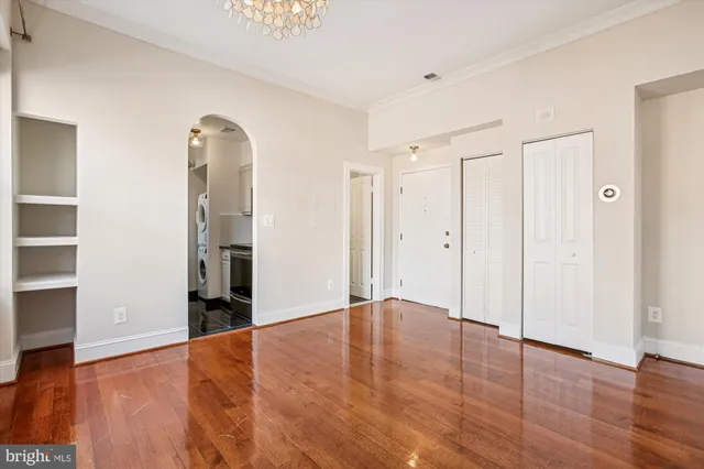 an empty room with wooden floor