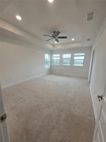 a view of a big room with carpet