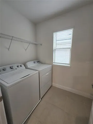 a view of an empty room with a fan