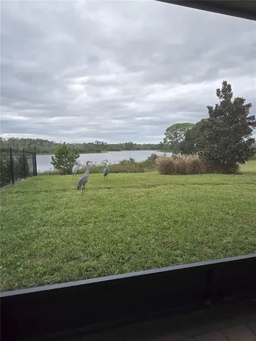 an aerial view of a house with a swimming pool