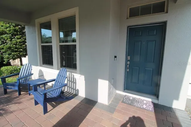 a balcony with furniture and window