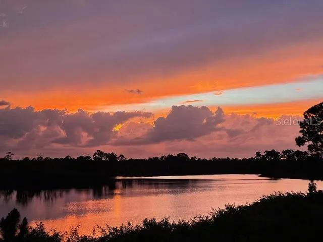 a view of house with outdoor seating yard and swimming pool
