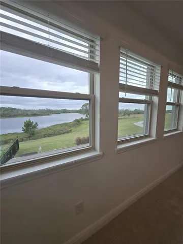 a kitchen with granite countertop a refrigerator oven a sink and dishwasher