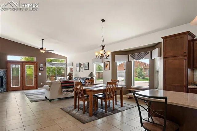 a view of a dining room with furniture window and outside view