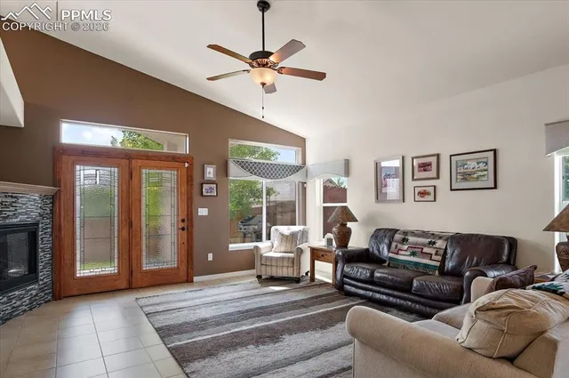 a living room with furniture and a fireplace