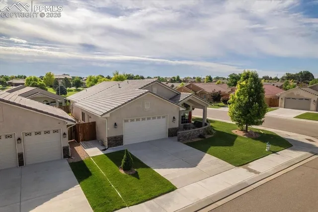 an aerial view of residential houses with outdoor space