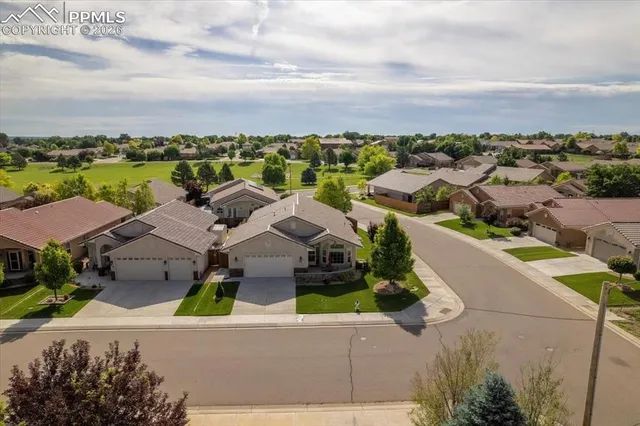 an aerial view of a house with a lake view
