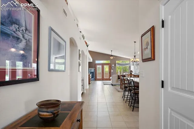 a lobby with furniture and a potted plant