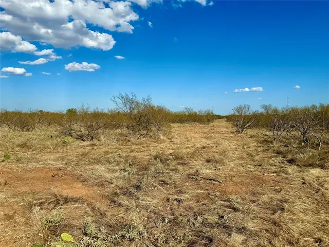 a view of a water with an ocean beach