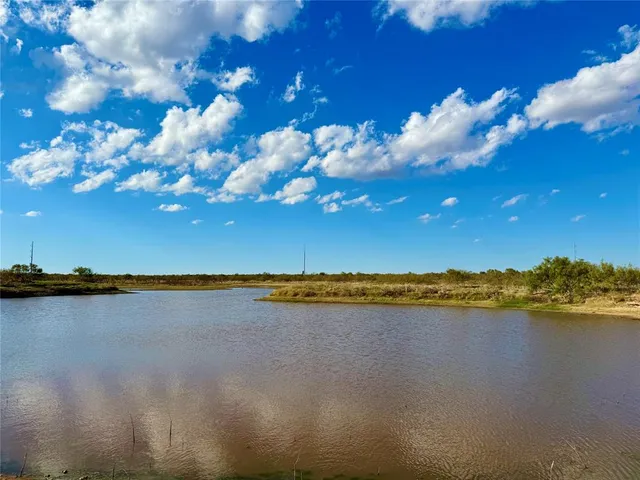 a view of a lake with a yard