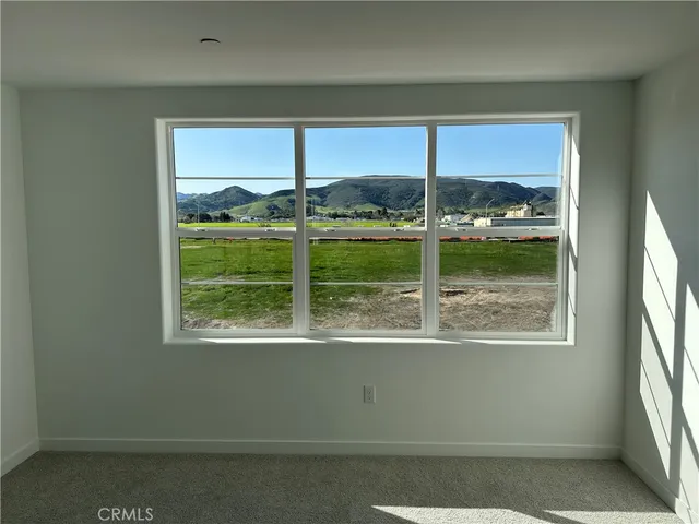 a view of a room that has a large window