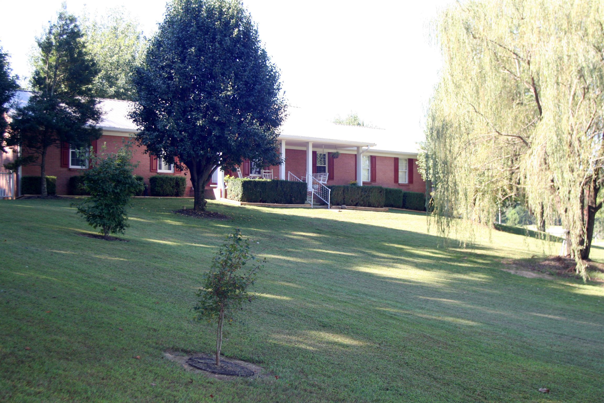 984 Dixie Bee Road Adams, TN 37010 - Photo 1 of 18 a view of a house with a yard