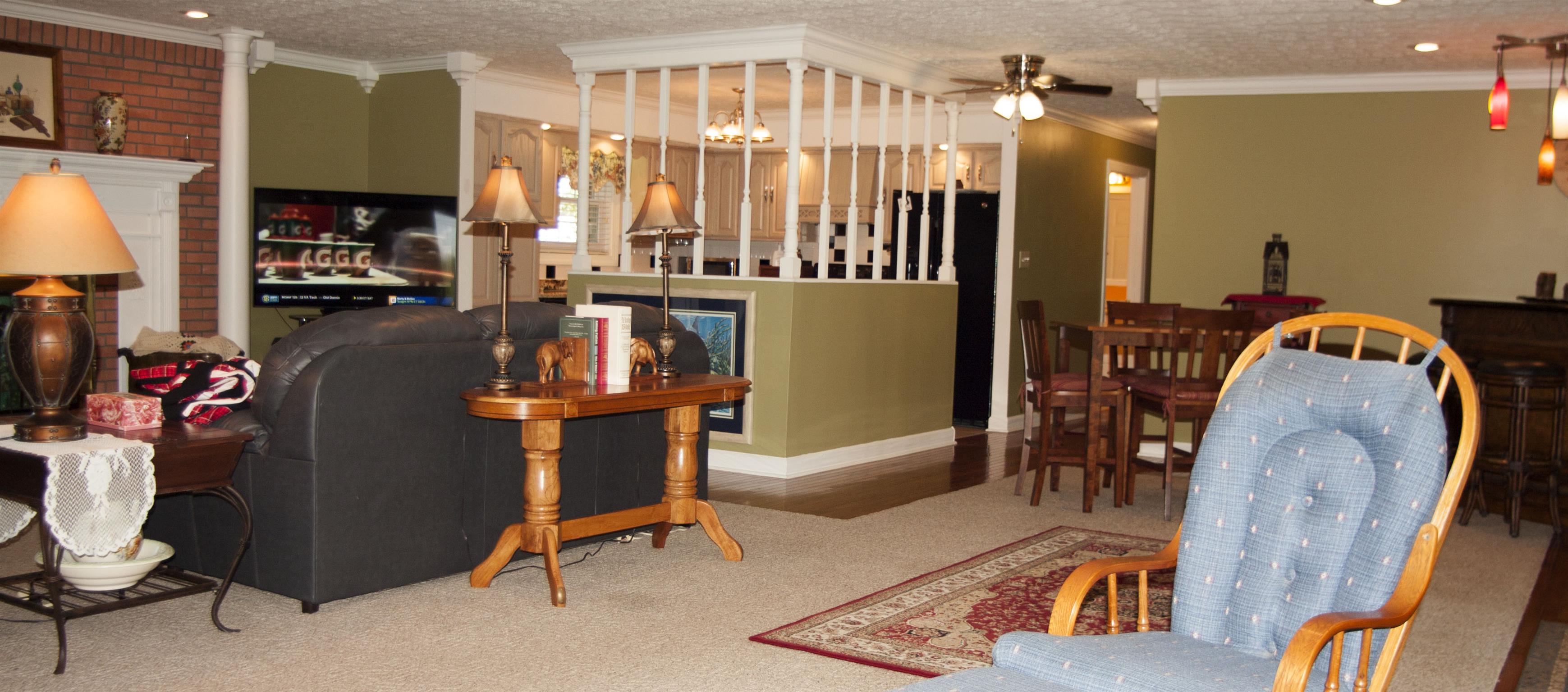 984 Dixie Bee Road Adams, TN 37010 - Photo 8 of 18 a living room with furniture a flat screen tv and a table