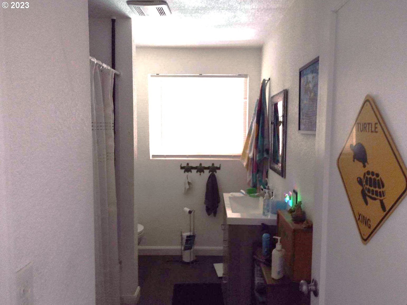 2631 F Street Springfield, OR 97477 - Photo 3 of 5 a bathroom with a sink and a mirror