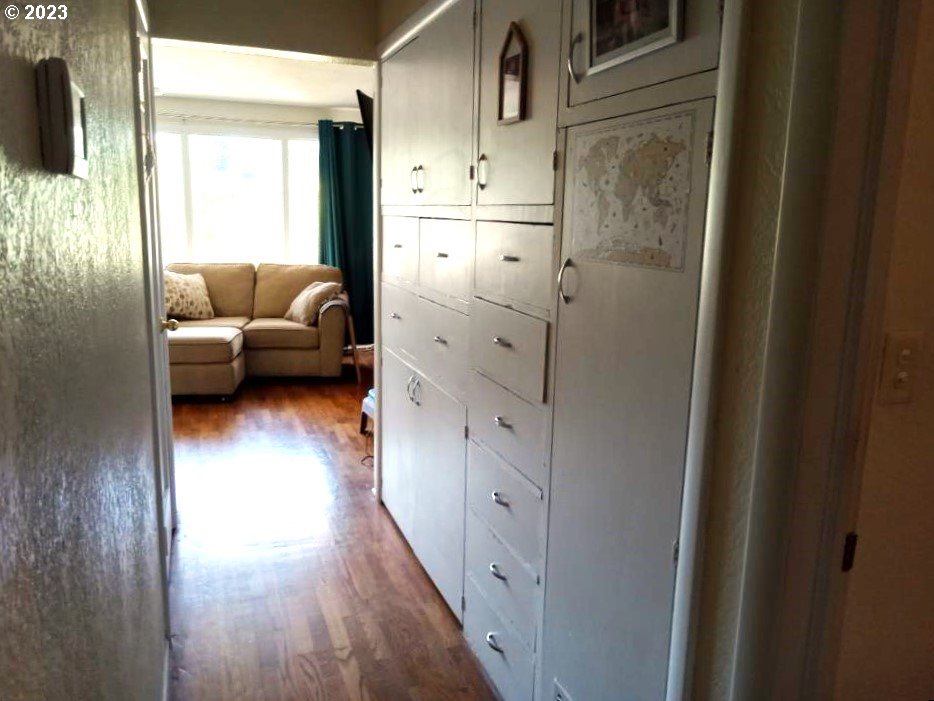 2631 F Street Springfield, OR 97477 - Photo 5 of 5 a kitchen with white cabinets and wooden floor