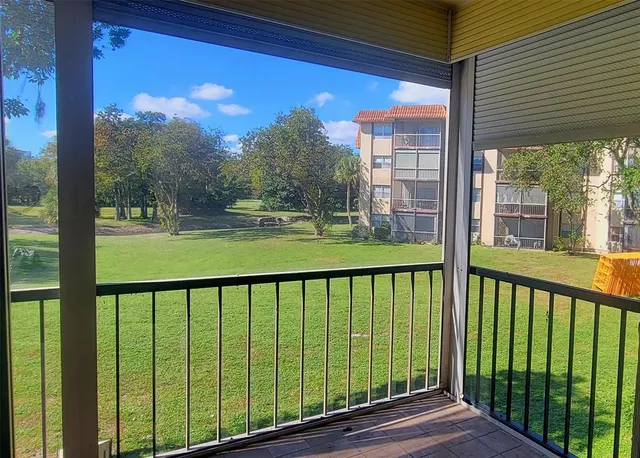 a view of a porch with a yard