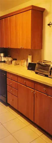 a view of a room with an empty space and a window