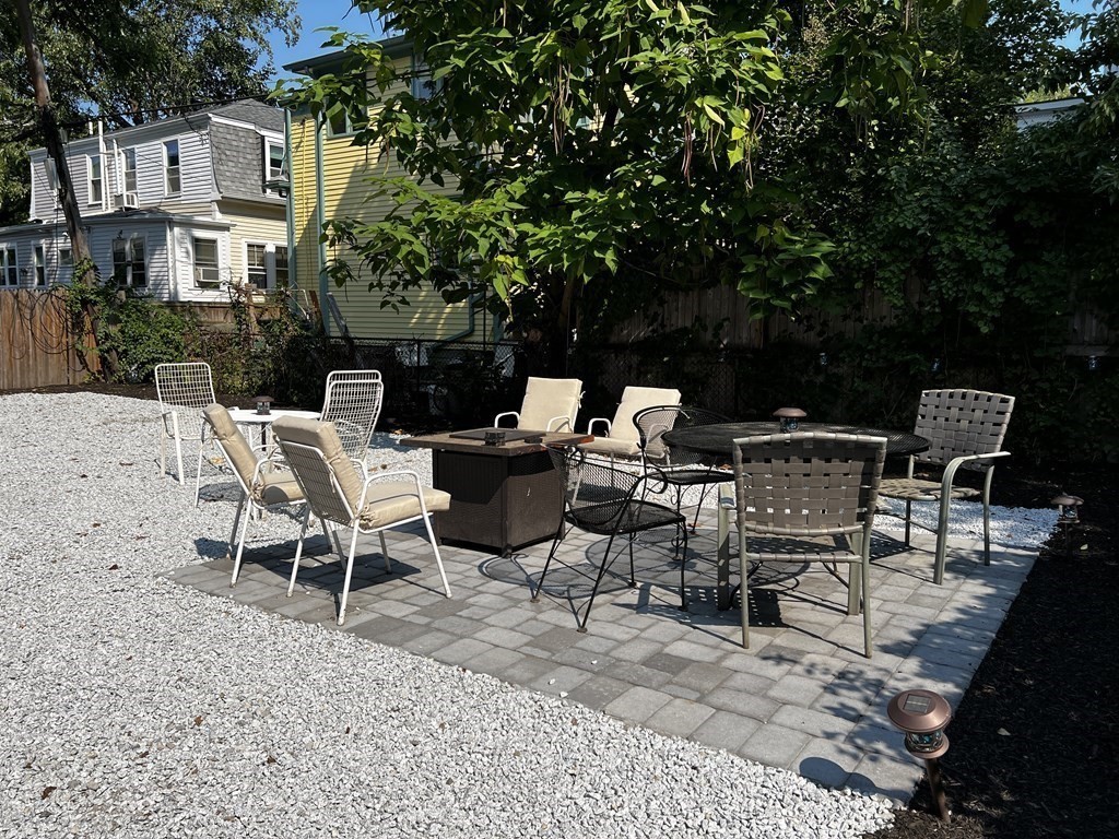 102 Trowbridge Street, Unit 2L Cambridge, MA 02138 - Photo 16 of 16 a view of a patio with a table and chairs