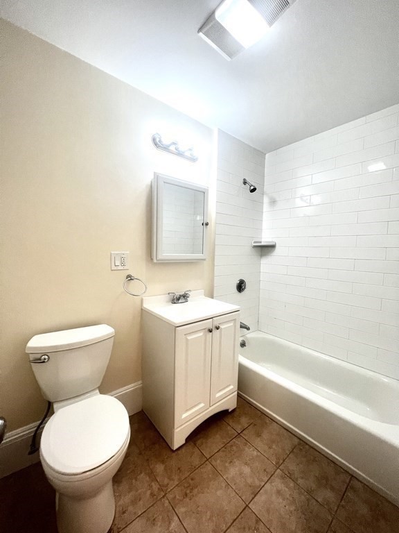102 Trowbridge Street, Unit 2L Cambridge, MA 02138 - Photo 9 of 16 a bathroom with a toilet sink and mirror
