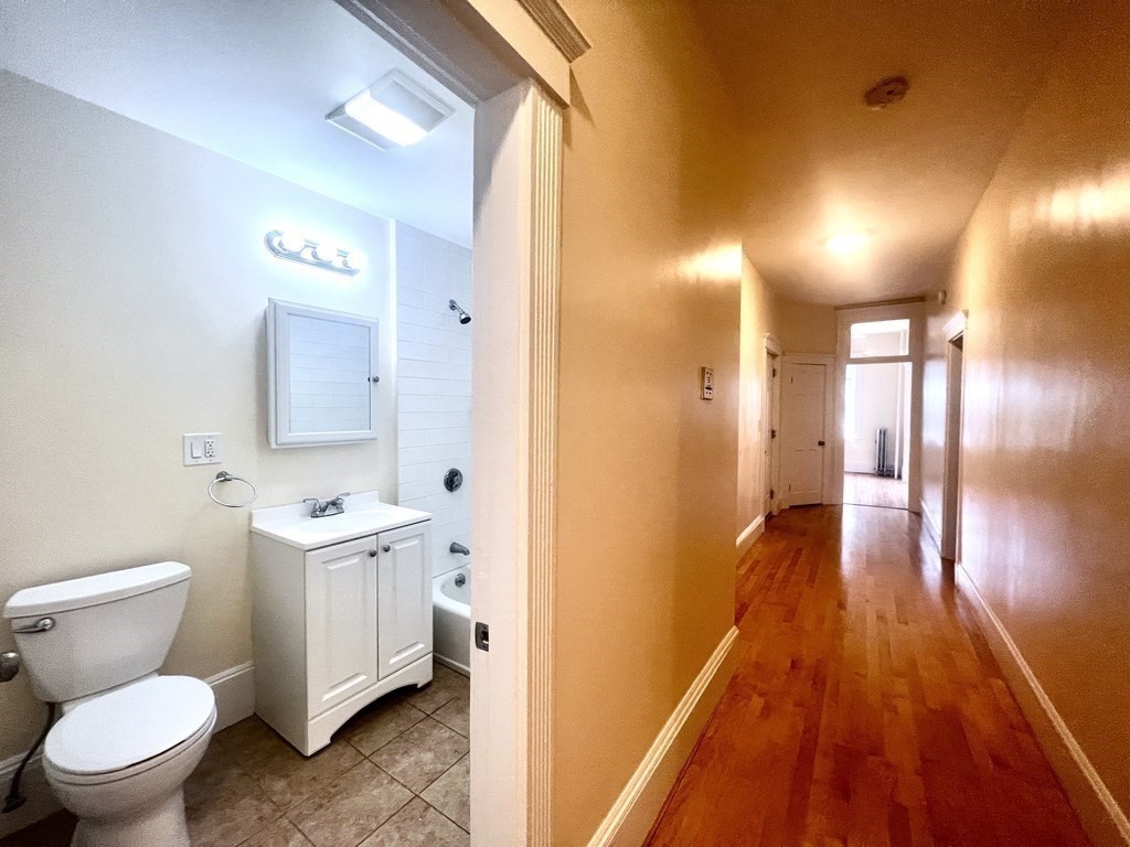 102 Trowbridge Street, Unit 2L Cambridge, MA 02138 - Photo 10 of 16 a bathroom with a sink and a mirror