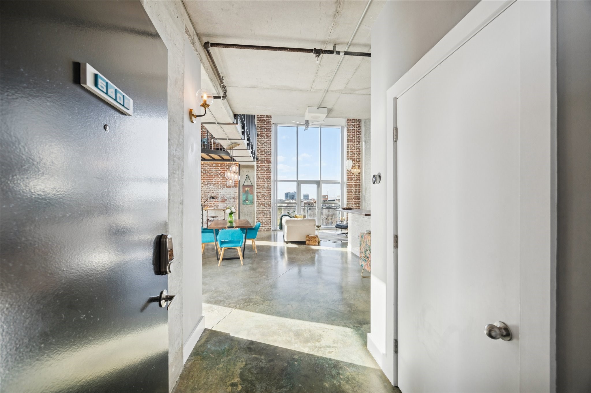 2000 Bagby Street, Unit 5400 Houston, TX 77002 - Photo 3 of 47 Stepping into Unit 5400, you’re immediately welcomed by one of the most unique and striking residences in the building