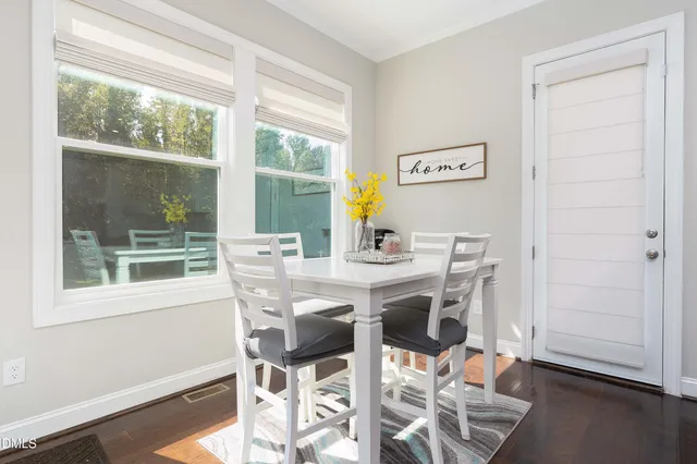 a living room with furniture dining table and a fireplace