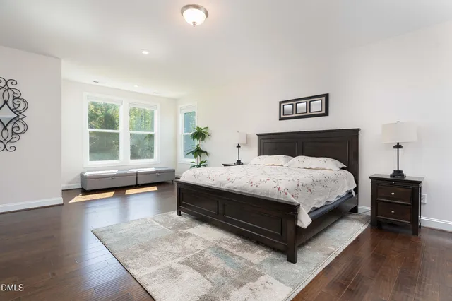 a bed room with a bed window and a television