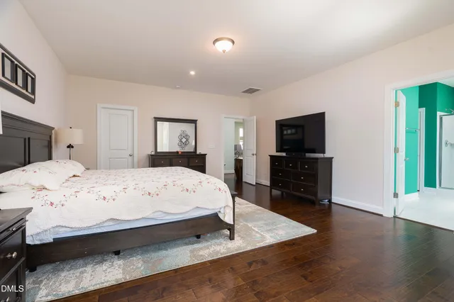 a bathroom with a double vanity sink and mirror