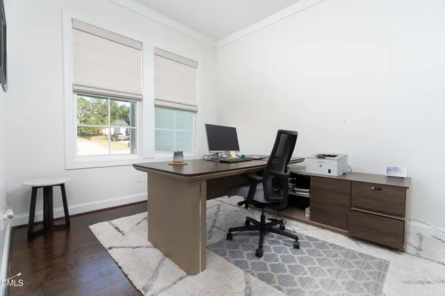 a kitchen with granite countertop white cabinets and appliances