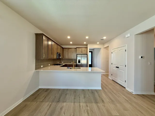 a view of kitchen with wooden floor