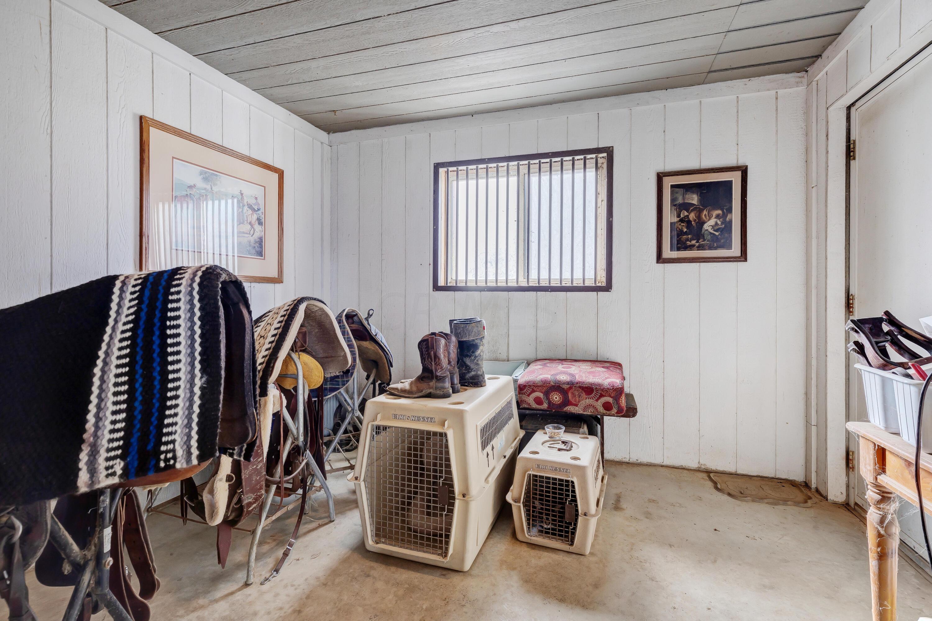 6681 Harlem Road Westerville, OH 43082 - Photo 65 of 78 • Concrete floor • Kennels do not convey • Ceiling fans • Insulated • Water and electric (tied to house) • Utilty sink • Front and rear door • Covered patio area • Hasel door to Barn • Dog kennel fencing does not remain