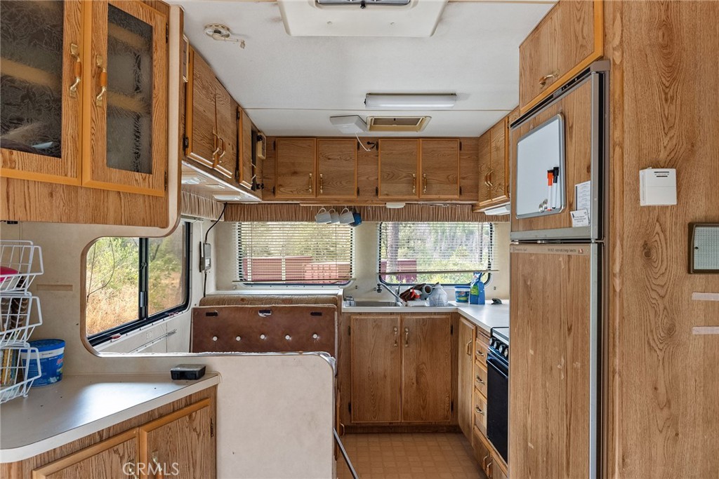 0 Deadwood Road Oroville, CA 95965 - Photo 25 of 55 a kitchen with granite countertop a sink appliances cabinets and a counter top space