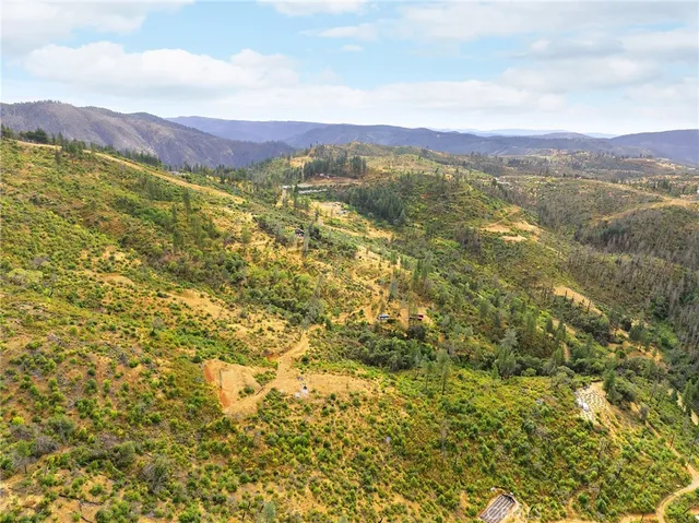 a view of a city with mountains in the background