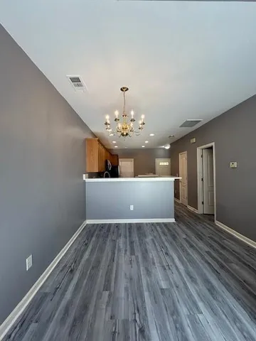 a view of entryway with wooden floor