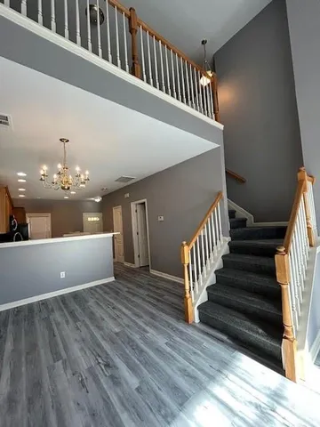 a view of wooden floor in a room next to a window