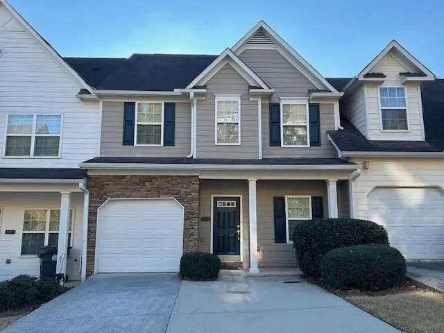 a view of a brick house with a large windows