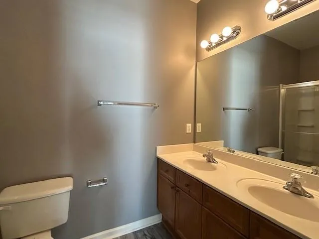 a wooden bench sitting in a forest