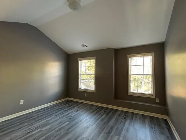a bathroom with a sink a toilet a mirror and vanity