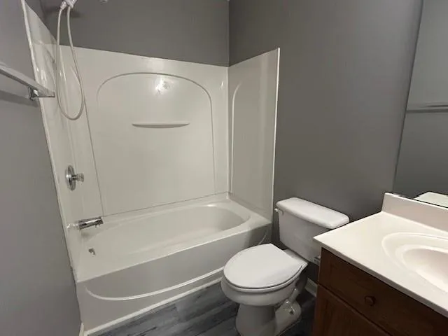 a white refrigerator freezer and a stove sitting inside of a kitchen