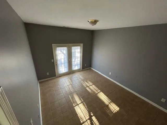 a view of empty room with windows