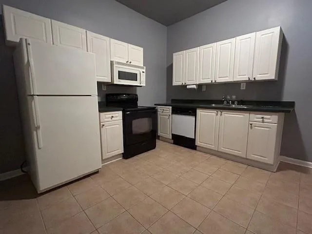 a view of a door of a house with a porch