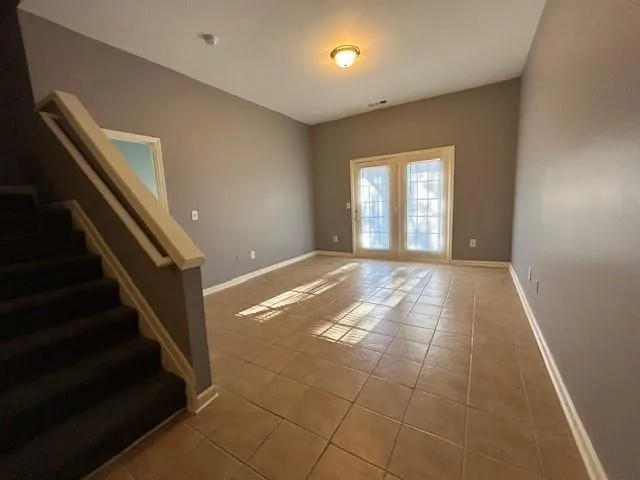 a view of an empty room and window