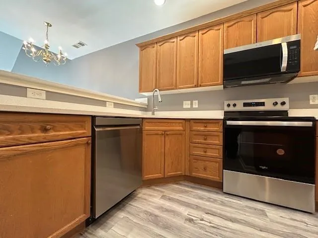 a kitchen with a stove and a microwave