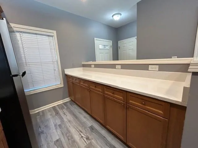 a bathroom with a sink a mirror and a bathtub