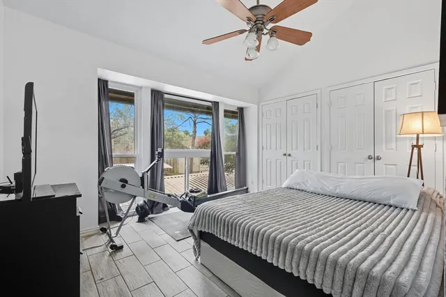 a bedroom with a bed and a mirror