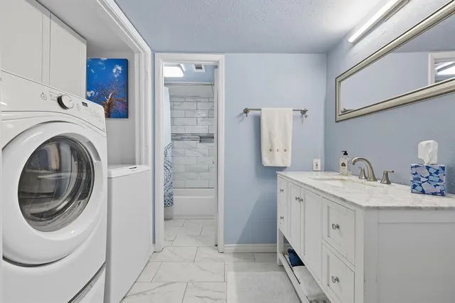 a spacious bathroom with a sink a toilet and shower