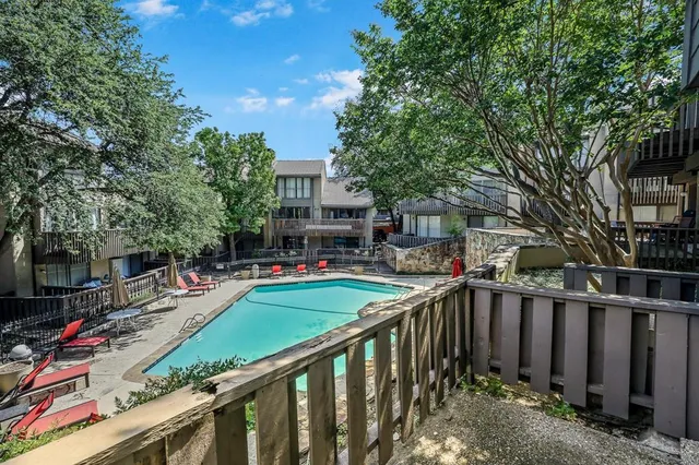 a view of street from balcony