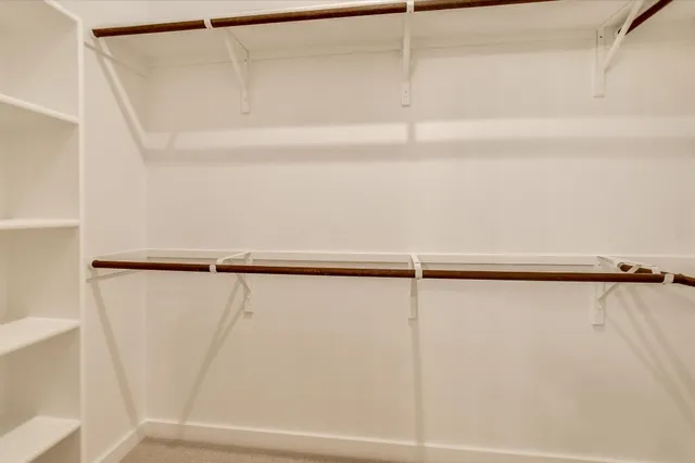 a bathroom with 2 sink and a mirror